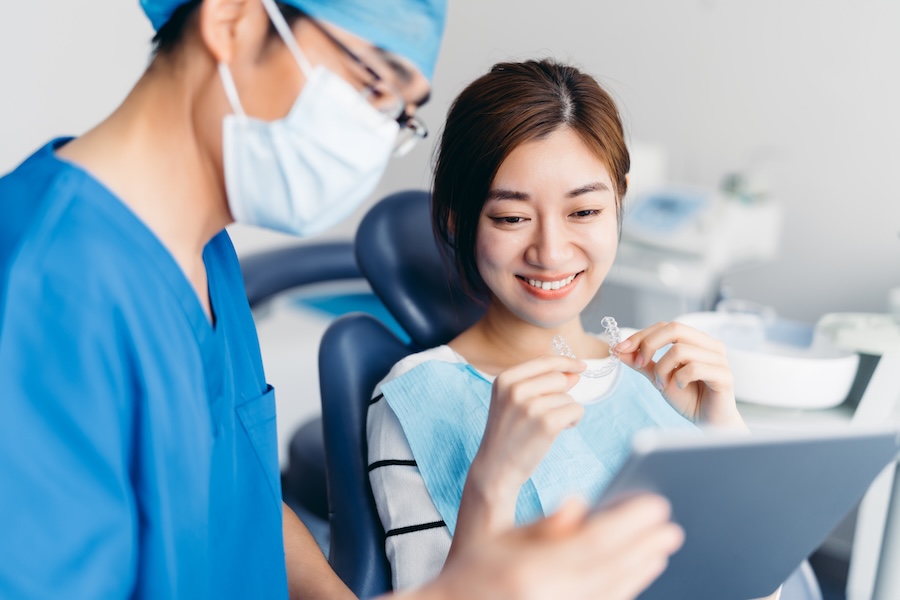dental assistant helping a patient at the dental office, dental assistants help the dental office run smoother